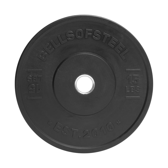 The All-Black Bumper Plate by Bells of Steel is a 15 lbs weight plate made from recycled rubber for durability, featuring "BELLSOFSTEEL" and "EST. 2010" engraved around its central hole.