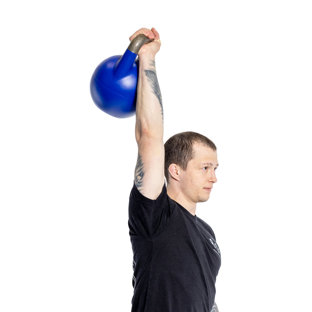 A person in a black shirt lifts a Bells of Steel Adjustable Competition Kettlebell overhead with one arm, set against a plain white background.