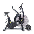 The Bells of Steel Blitz Max Air Bike, featuring a large front fan, adjustable seat, pedals, and handlebars, is shown in profile on a white background.