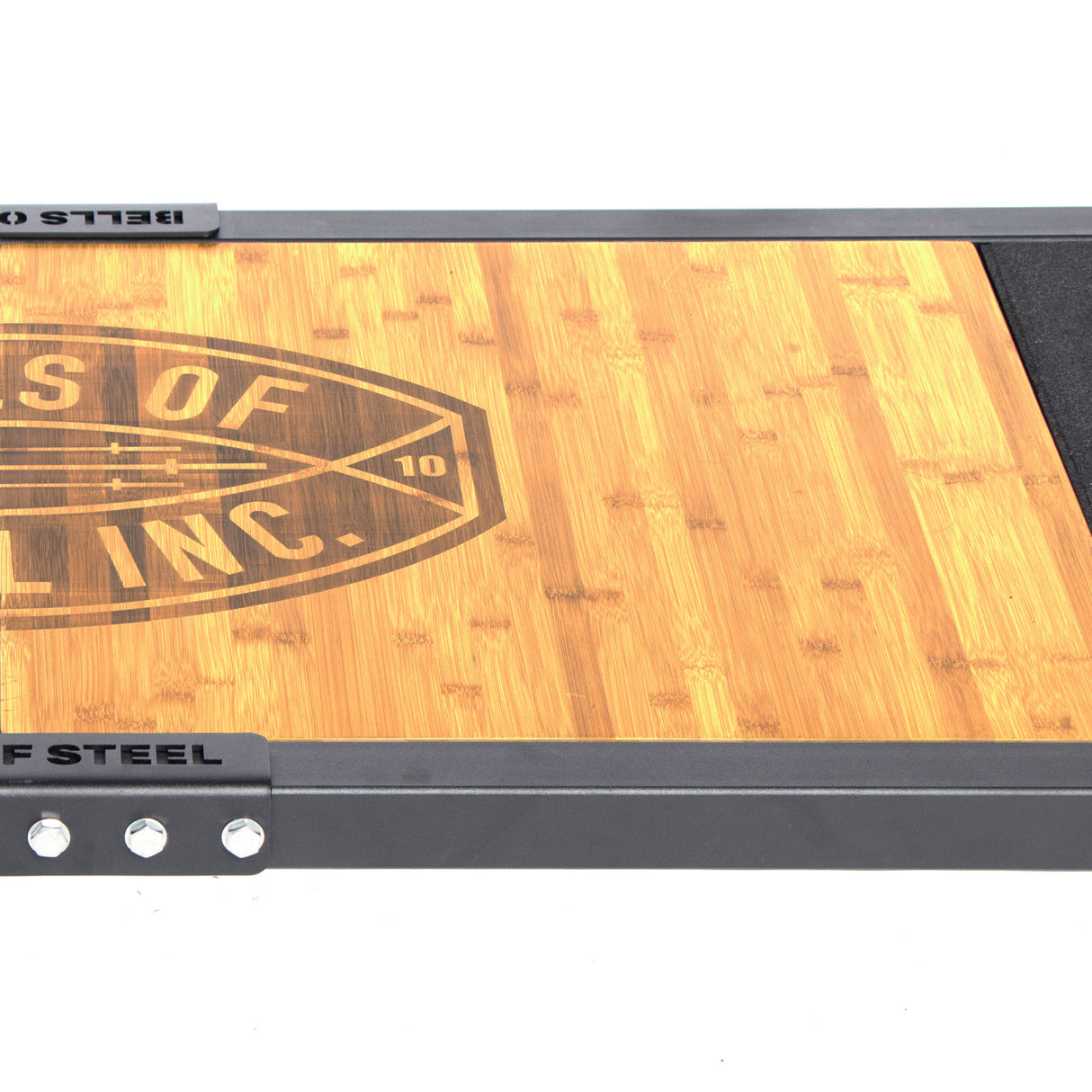 A wooden lifting platform with a steel frame, branded as "Bells of Steel," is shown. Its edge features metal bolts, and the stable surface boasts a bamboo insert pattern. The logo reads "Pounds of Lifting Inc.