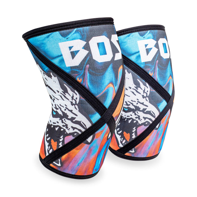 Introducing the Knee Sleeves by Bells of Steel: These vibrant sleeves provide exceptional compression support, featuring a striking design in blue, orange, and black patterns. Adorned with the word "BOSS" next to an abstract lion graphic for a bold statement.