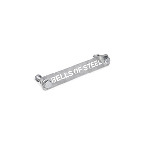 The Manticore Hardware from Bells of Steel is a metal bar with "BELLS OF STEEL" etched into it, equipped with bolts on each end to perfectly complement your Manticore Power Rack setup. It comes with a hardware kit and assembly instructions for straightforward installation.