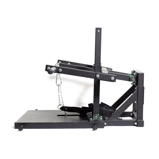 The Bells of Steel Belt Squat Machine is a black, heavy-duty fitness device perfect for building lower body strength. It features a flat base with vertical and horizontal bars for resistance training, making it ideal for any home gym. Its sleek design includes wheels for easy maneuvering.