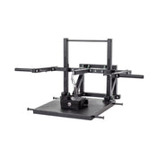 The Bells of Steel Black Belt Squat Machine is ideal for a home gym, featuring horizontal bars and a central platform with a chain and weight attachment to enhance lower body strength through targeted exercises.