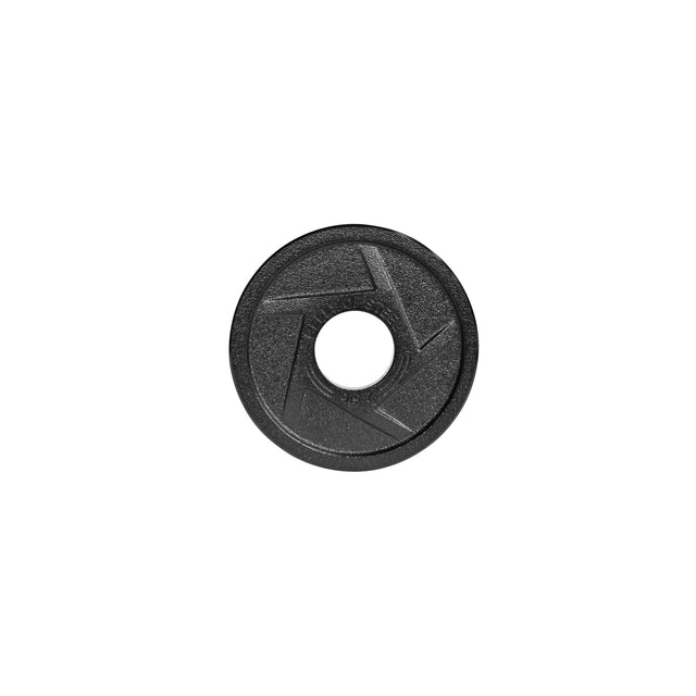 A black, circular Olympic weight plate by Bells of Steel, known as the Black Mighty Grip, is shown on a white background and features an aperture symbol design in the center that brings to mind the precision grip handles of ergonomic designs.