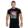 A man smiles, wearing the Bells of Steel Bamboo T-Shirt in black, featuring moisture-wicking fabric and colorful "HYDRA BEAST SERIES" text with a dragon head graphic. The background is plain white.