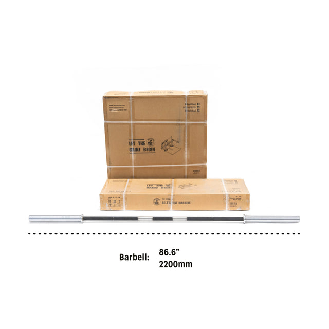 A space-efficient setup for improving lower body strength is shown with a long silver barbell, measuring 86.6” (2200mm), in front of two cardboard boxes. The plain white background complements the Belt Squat Machine by Bells of Steel.