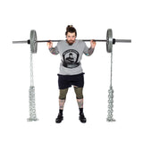 Athlete demonstrating squats with chains