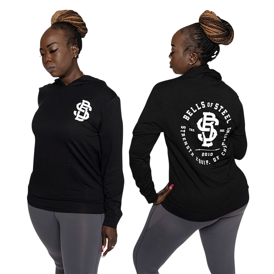 Female model standing while wearing Champions hoodie front and back print