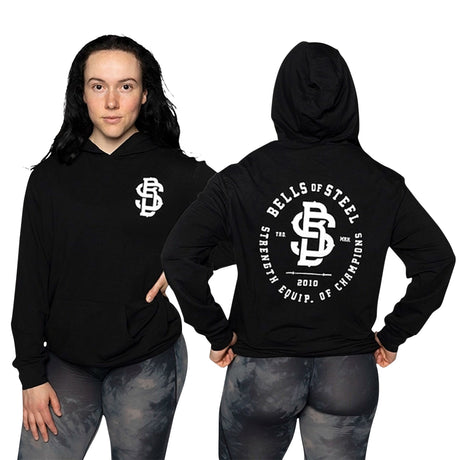 Female model wearing Champions Hoodie and holding her waist front and back print