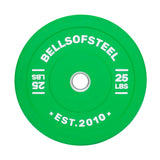 The Bells of Steel Coloured Bumper Plate, established in 2010, is a vibrant green and features white text displaying "Bells of Steel" and "25 lbs." It includes a durable central stainless steel insert ring for optimal performance and precise weight accuracy.