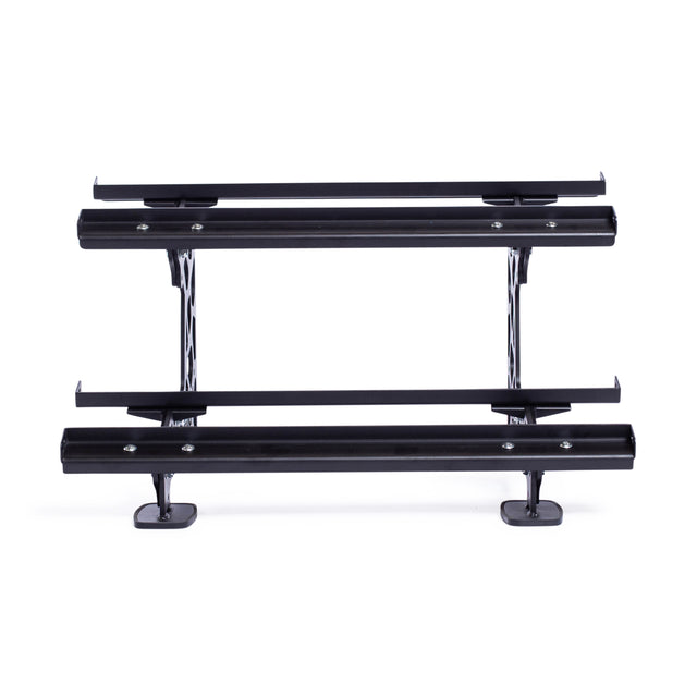 The Commercial Interchangeable Weight Rack by Bells of Steel features textured black metal steps with a sturdy design on a supportive framework. With its black and white pattern, it complements vehicles or platforms and goes well with commercial urethane dumbbells in any fitness setup.