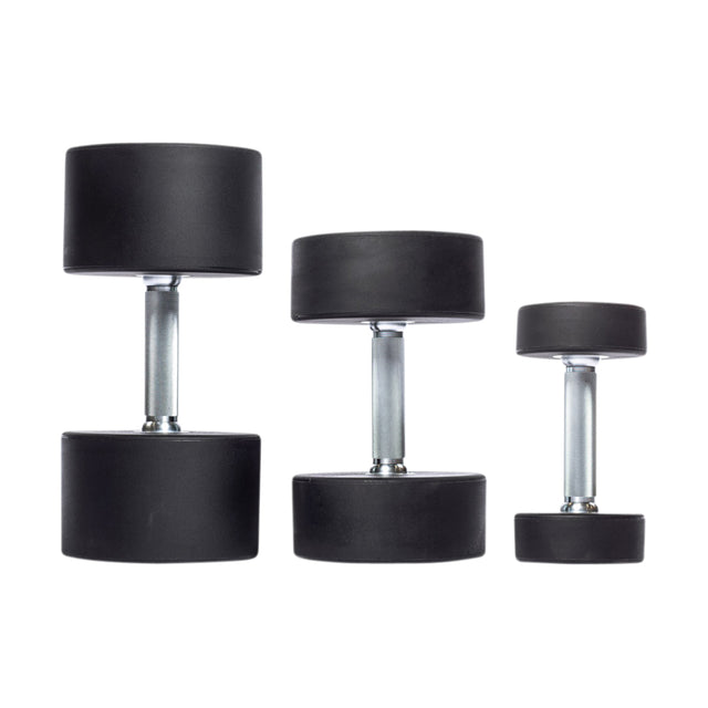 Three black Bells of Steel Urethane Dumbbells are arranged in ascending order from right to left on a white background, with cylindrical weights and metal handles reflecting their commercial-grade quality.