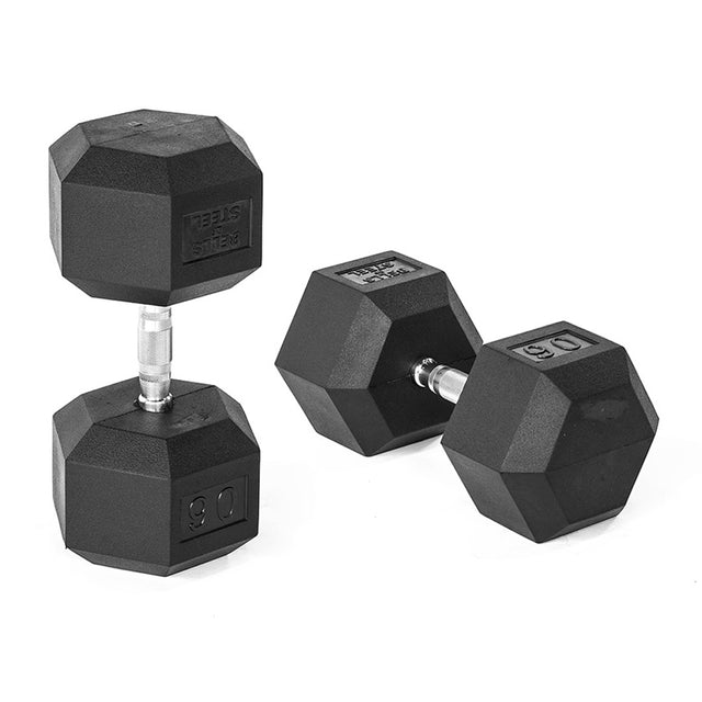 A pair of black Ergo Rubber Hex Dumbbells by Bells of Steel, featuring ergonomic chrome handles, rests on a white background. One upright dumbbell shows 90 while the other lies flat, displaying a label and number 90.