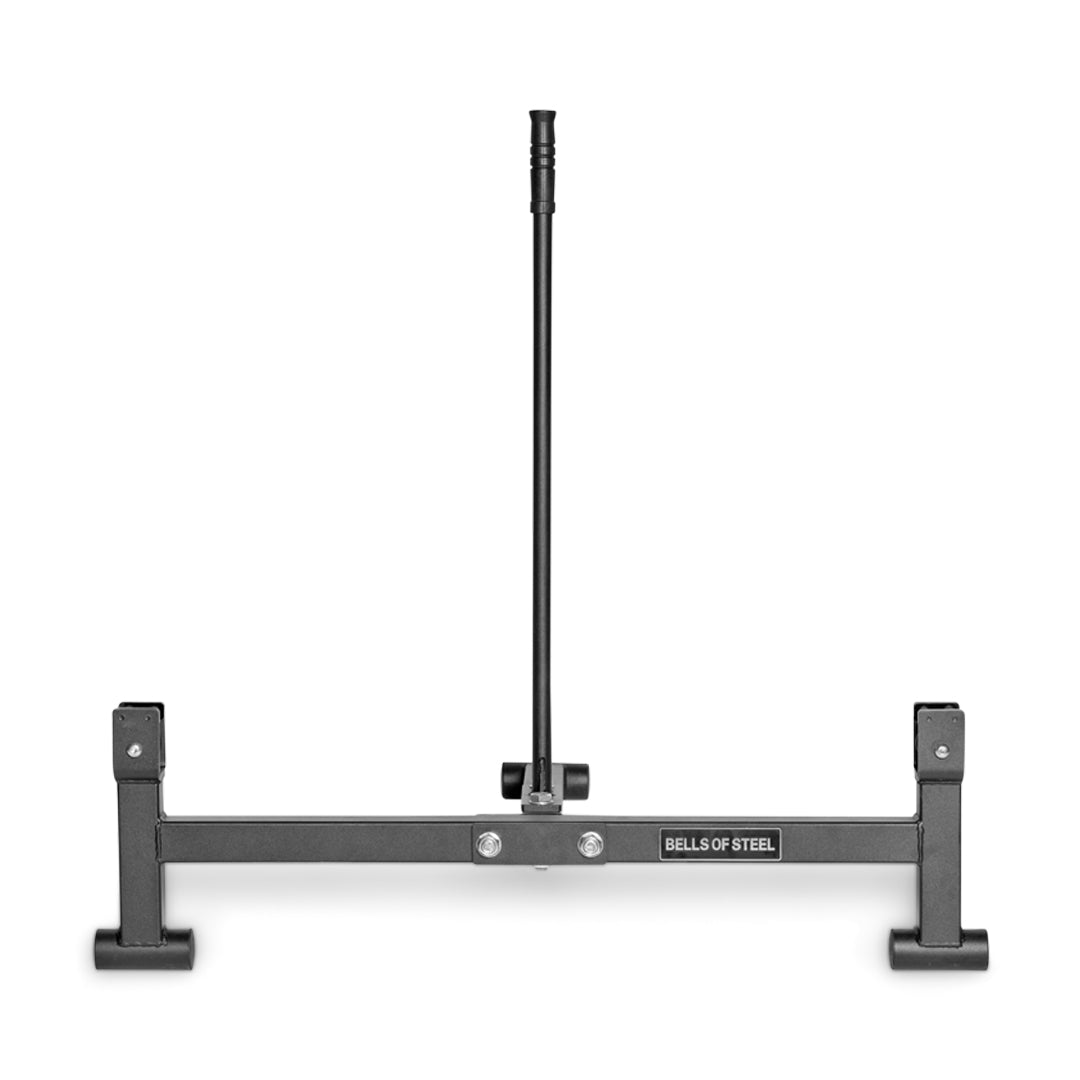 The Bells of Steel Deadlift Jack with Rollers has a vertical black central post on a stable base, featuring nylon rollers for smooth weight changes. It's ideal for organizing and storing weightlifting plates.