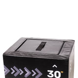 A close-up of the top corner of a black Bells of Steel 6-In-1 Soft Foam Plyo Box / Squat Box shows a handle on top and “30”” in white on the side, with arrows highlighting this space-saving exercise equipment.