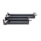 Three black metal Flip-Down Safeties from Bells of Steel are arranged parallel to each other on a white background—perfect for enhancing your power rack setup and prioritizing training safety.