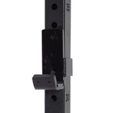 Close-up of the Bells of Steel Folding Rack 2.3" x 2.3" with 5/8" holes, a black metal wall-mounted squat rack upright featuring numbered holes and a J-cup at the 30 mark, supporting up to 600 lbs—ideal for garage gyms.