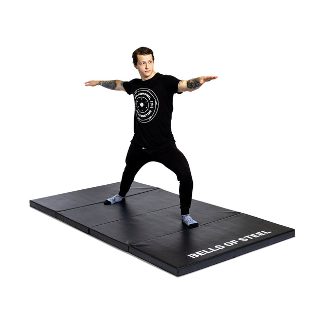 Fitness Enthusiast Showcasing the non-slip surface of the Four Fold Mat