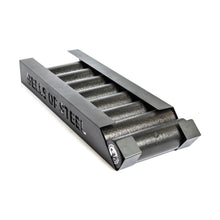 A set of cylindrical steel weights in a black rack with "Bells of Steel" cut out on the side—ideal for pairing with your Bells of Steel Foam Roller Storage or wall-mounted gym setup.