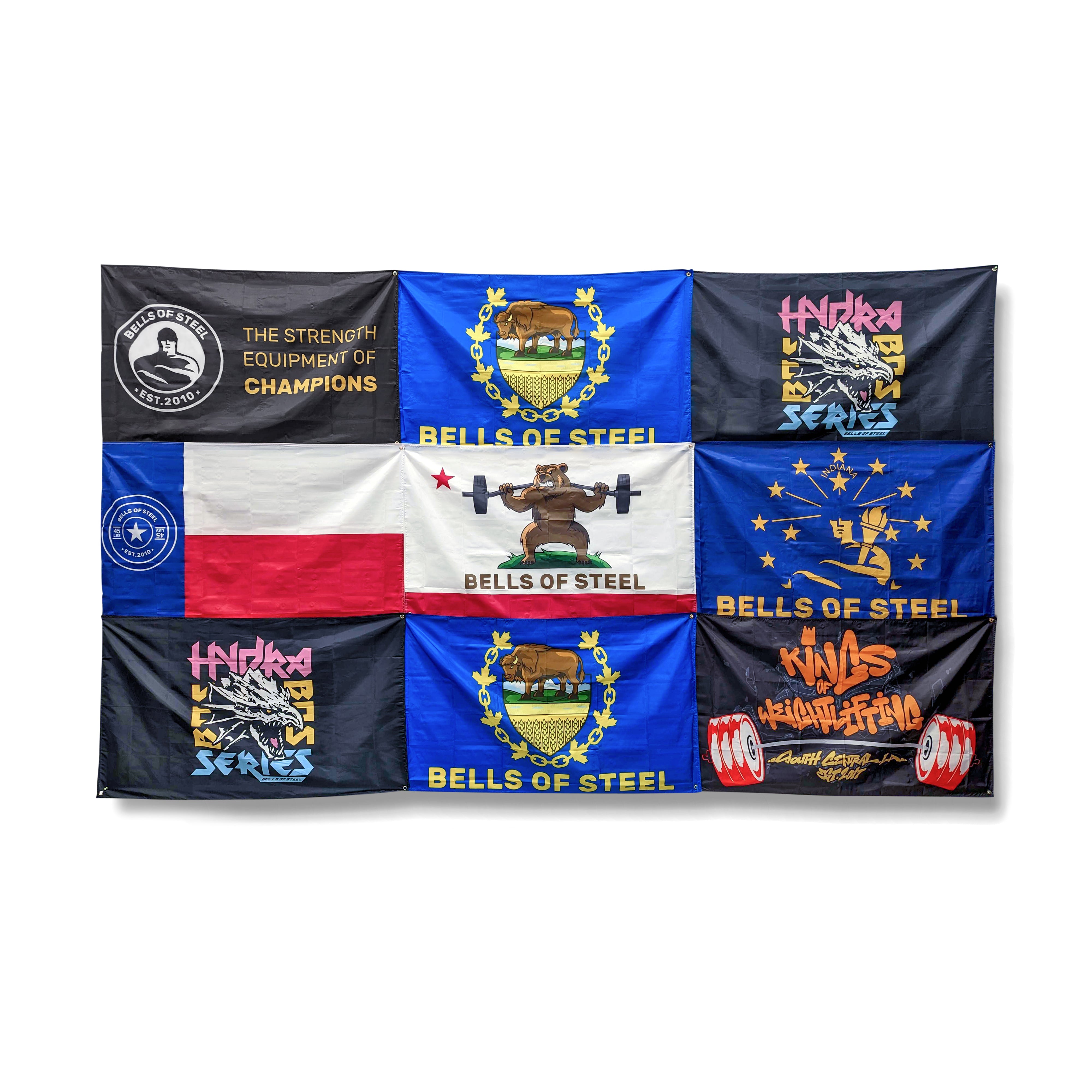 A collection of nine vibrant "Bells of Steel" flags, each featuring unique designs and inscriptions related to weightlifting. These banners display logos, weightlifting imagery, and stylized text in various color schemes, ideal for adding flair to your home gym decor.