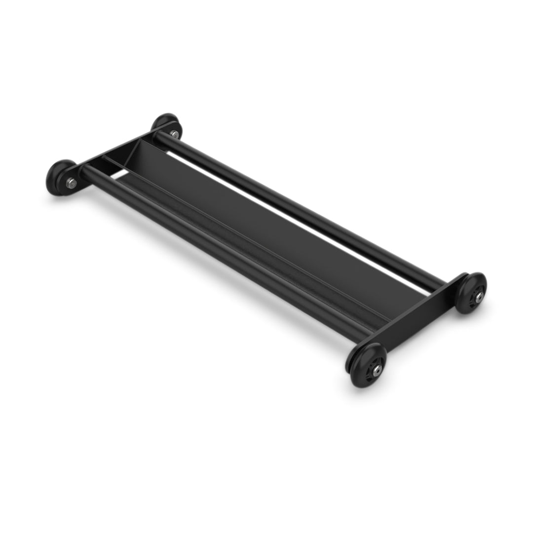 The Bells of Steel Glute Ham Slider is accompanied by a black, rectangular metal stand featuring two parallel bars and four wheels, perfect for holding or transporting items. This setup is displayed on a plain white background.