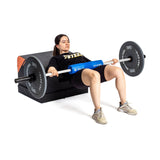 Female athlete using the Soft Glute Bench for barbell hip thrust