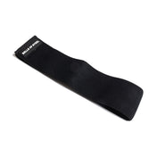 A durable black fabric resistance band branded with "Bells of Steel" on one end, set against a white background. The Glute Loop is designed with a non-slip layer to remain flat and secure during fitness exercises.