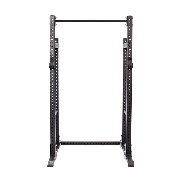 The Bells of Steel Hydra Half Rack is a black metal rack with 3" x 3" posts and ⅝" holes for adjustable safety bars. Featuring a pull-up bar, it's perfect for weightlifting and strength training in your home gym, with a sleek design that stands out on a white background.