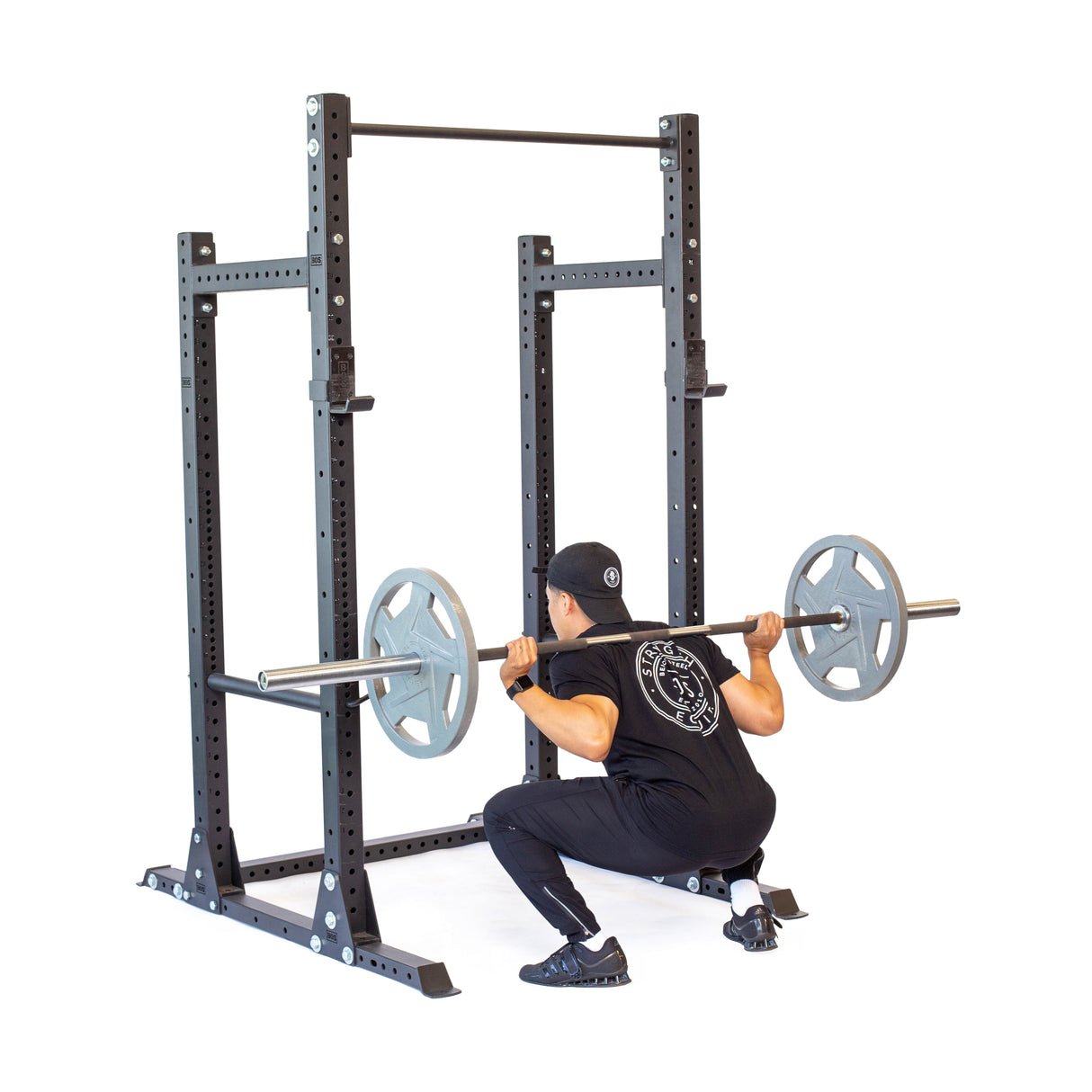 Product picture of Hydra Half Rack PREBUILT with a male model performing squats