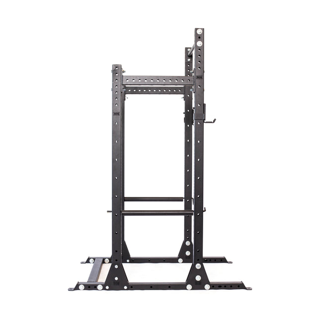 The Bells of Steel Hydra Half Rack Builder, featuring 3" x 3" modular black metal components with ⅝" holes, offers adjustable hooks and safety bars for weightlifting. This versatile rack is set on a sturdy base and showcased against a plain white background for optimal viewing.