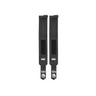 Two black Mighty Wrist Wraps by Bells of Steel, featuring velcro closures, white BOS logos, and pink and white graffiti-style graphics on the ends, displayed side by side on a white background for wrist support.