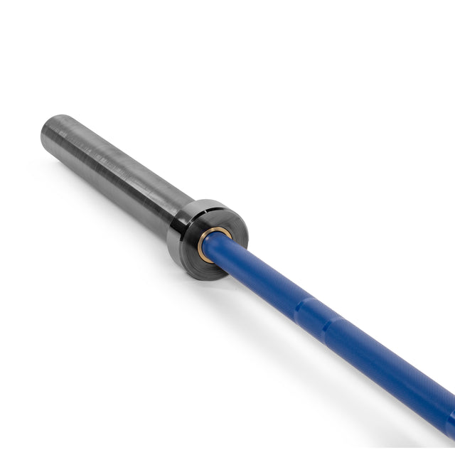 Close-up of a blue Multi-Purpose Olympic Barbell by Bells of Steel, with a metallic finish on the sleeve. The generalist Utility Bar is diagonally positioned against a white background, highlighting its medium-light knurl for textured grip and smooth, shiny sleeve.