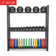 The Bells of Steel Hydra Storage Builder gym rack neatly stores black medicine balls, dumbbells, and colorful weight plates. A red label in the top left corner announces “10% off.”.