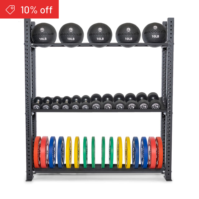 The Bells of Steel Hydra Storage Builder gym rack neatly stores black medicine balls, dumbbells, and colorful weight plates. A red label in the top left corner announces “10% off.”.