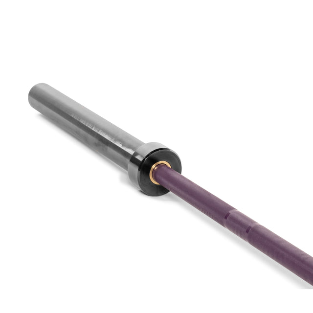 A Bells of Steel Multi-Purpose Olympic Barbell, The Utility Bar, features a matte gray metal sleeve and purple medium-light knurl grip against a white background.