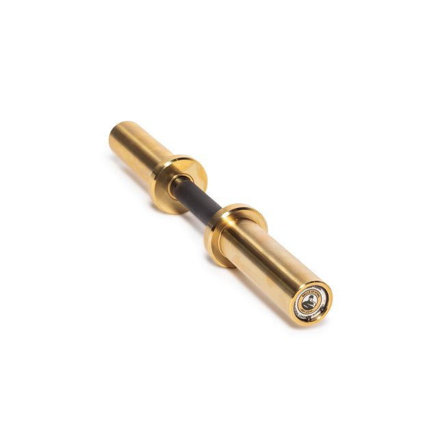 A Loadable Dumbbell Handle by Bells of Steel, featuring a gold metallic body with two cylindrical ends similar to Olympic bars. It has a shorter central black section and one end with a visible bearing mechanism, angled diagonally on a white background.