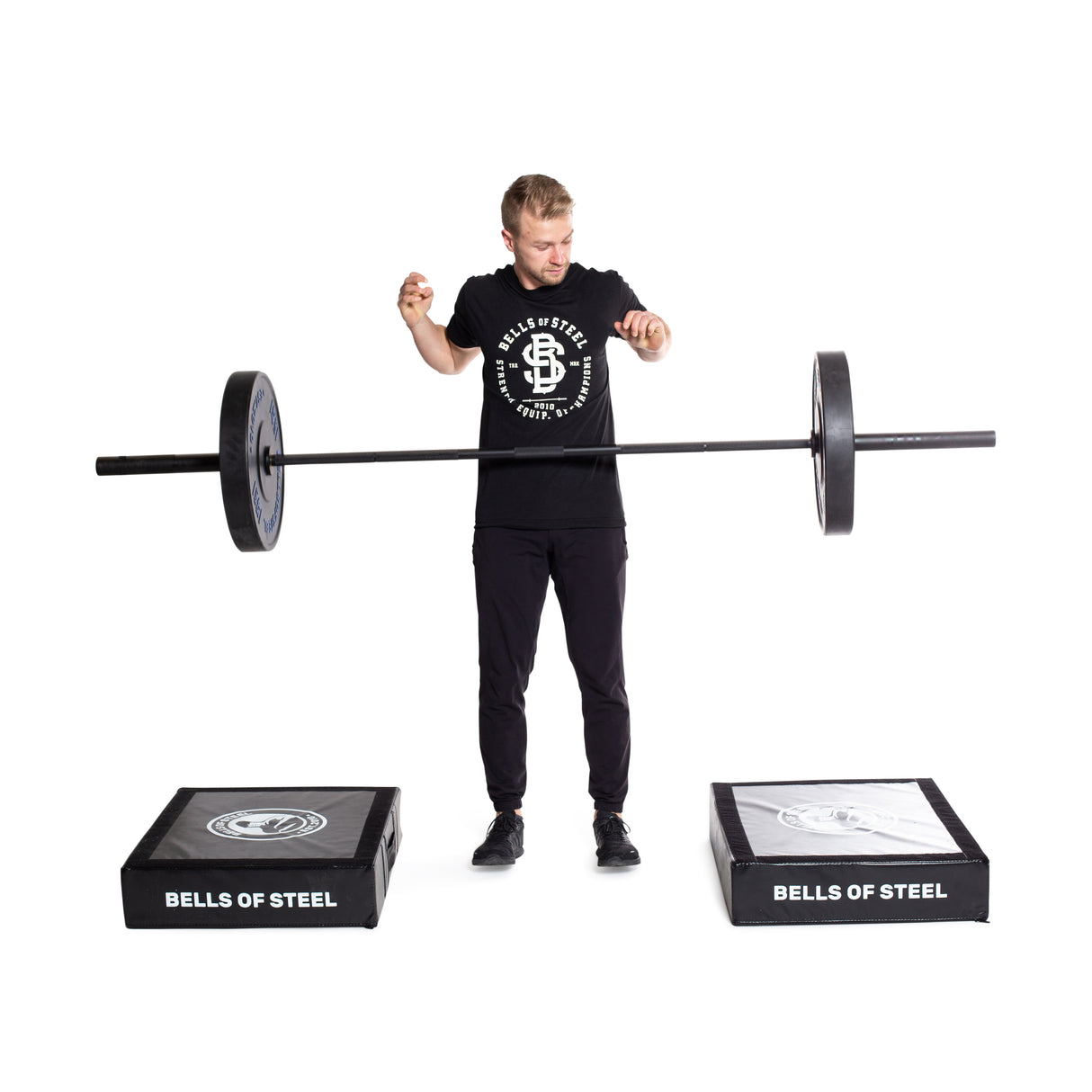 Male athlete dropping weights on a pair of Deadlift Pads
