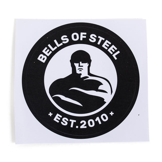 Featuring a robust black and white design, these vinyl die-cut stickers showcase a circular logo with "BELLS OF STEEL" prominently displayed at the top and "EST. 2010" at the bottom, centered around a muscular, shirtless figure with crossed arms. Perfect for making a bold statement.