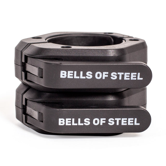 Two black Bells of Steel Magnetic Clamp Collars stacked together, each featuring “BELLS OF STEEL” in white on their levers—ideal for keeping weight plates secure during barbell workouts.
