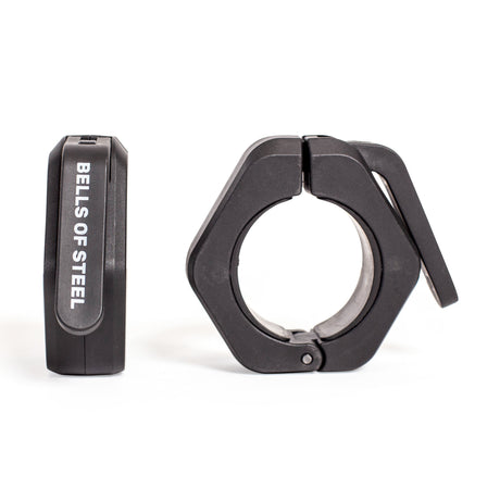 Two black Bells of Steel Magnetic Clamp Collars, one upright and one flat with the clamp lever open, are shown against a white background. These barbell collars securely hold weight plates in place.