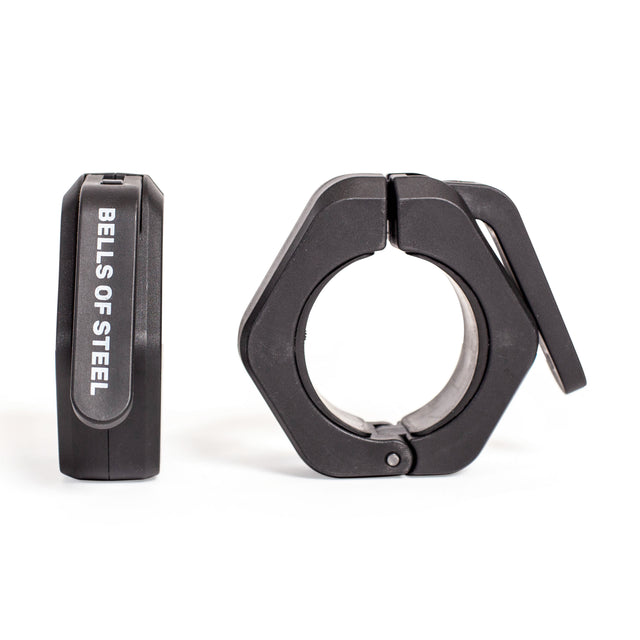 Two black Bells of Steel Magnetic Clamp Collars, one upright and one flat with the clamp lever open, are shown against a white background. These barbell collars securely hold weight plates in place.