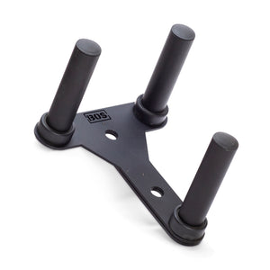 The Bells of Steel Change Plate Storage Pegs feature a black metal bracket with three rubber-capped cylindrical pegs, and a triangular base with two holes. They are ideal for organizing your power rack and seamlessly blend functionality into your setup.