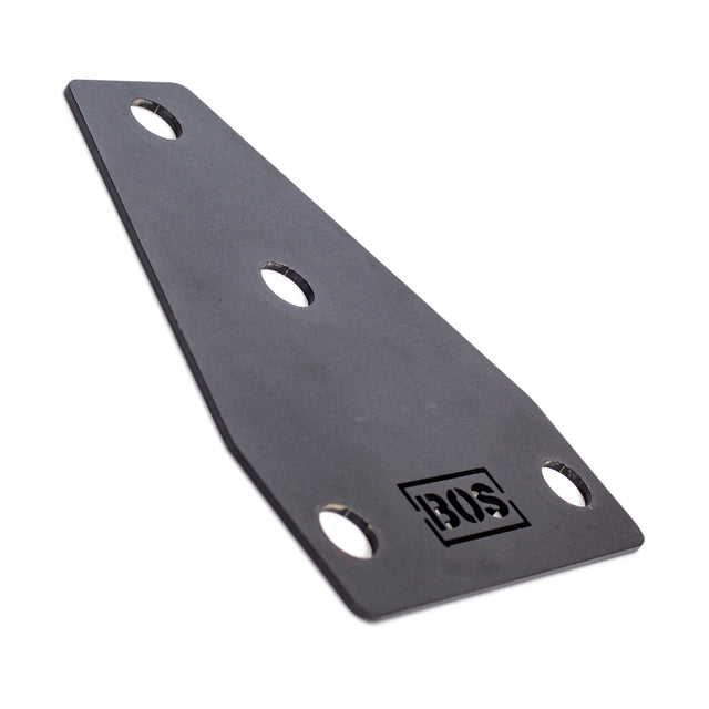 The Manticore Flat Foot Component by Bells of Steel is a gray, angled metal bracket with three evenly spaced holes for mounting, perfect for Manticore power racks. It features a stamped logo near one end and is shown on a plain white background.