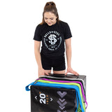 A woman in a black Bells of Steel t-shirt stands by a 20-inch plyo box, smiling at colorful Bells of Steel Fabric Non-Slip Resistance Bands (41") draped over the box. The background is white.