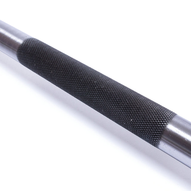 Close-up of the Bells of Steel Powerlifting Bar featuring a textured black grip. The surface is adorned with intricate diamond patterns to enhance grip during intense workouts. Renowned as the best budget power bar, this product has smooth and metallic ends.