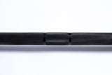 A close-up of the Bells of Steel Multi-Purpose Olympic Barbell – The Utility Bar, featuring a textured knurled grip. The black barbell, perfect for Olympic weightlifting, is set against a plain white background.