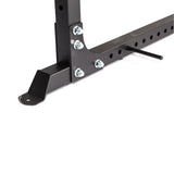 Close-up of the Bells of Steel Light Commercial Power Rack (2.3" x 2.3", ⅝" holes) in black metal, featuring multiple bolts, holes, and bracket details—ideal for home gym setups—shown against a white background.