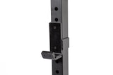 A close-up of black metal J-hook (j-cup) attached to a Bells of Steel Residential Power Rack (2.3" x 2.3", ⅝" holes) upright—an essential addition for any home gym setup.