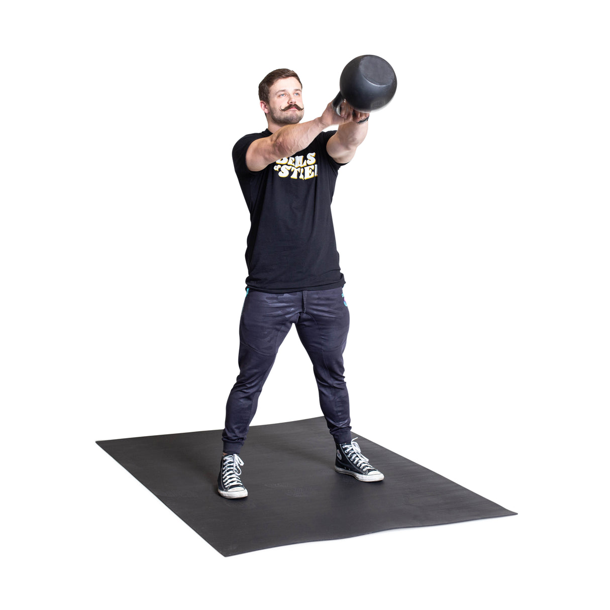 male athlete doing kettlebell swings with the 4' x 6' Rubber Floor Mat